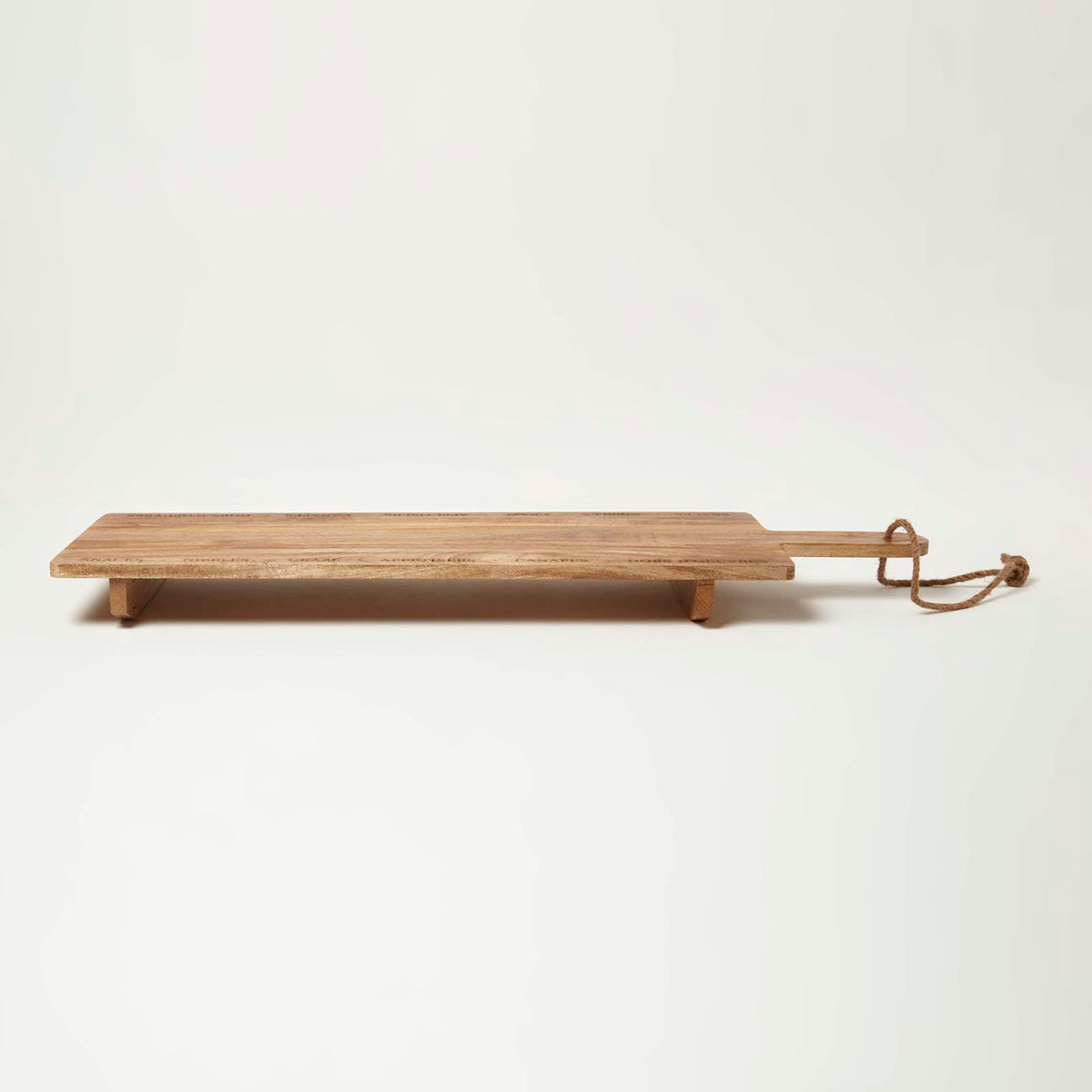 HOMESCAPES Engraved Mango Wood Serving Board, 100 X 30 Cm