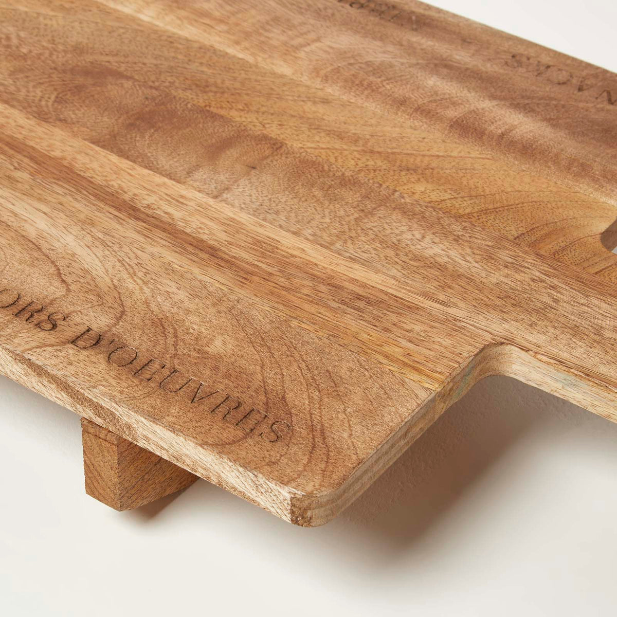 HOMESCAPES Engraved Mango Wood Serving Board, 100 X 30 Cm