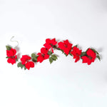 HOMESCAPES Artificial Red Velvet Poinsettia Garland, 195 Cm Long