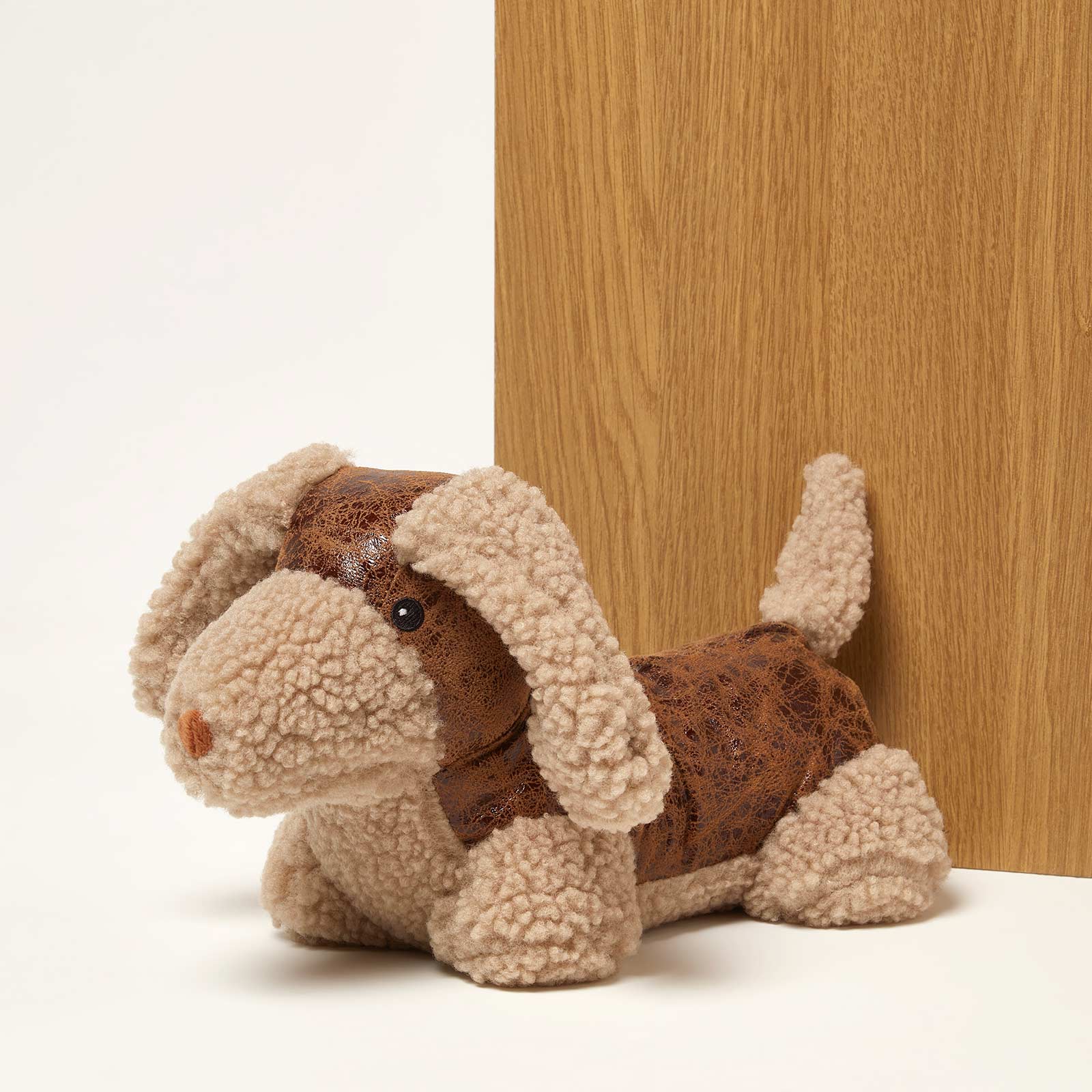 HOMESCAPES Luxury Sausage Dog Door Stop - Cream