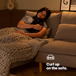 Livivo Long 2l Hot Water Bottle With Decorative Pom Poms And Washable Cover